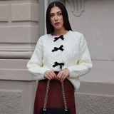 Jerseu Sabriel din tricot cu inchidere prin nasturi cu fundite