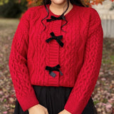 Jerseu Sabriel din tricot cu inchidere prin nasturi cu fundite