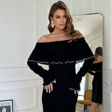 Rochie Annet neagra din tricot cu decolteu barcuta si reiatii