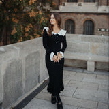 Rochie Asimera neagra din tricot cu guler lat si nasturi perlute
