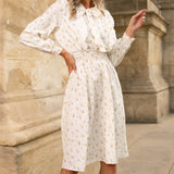 Rochie Silvy verde cu imprimeu floral si decolteu accesorizat cu nod