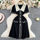 Rochie Eranthe neagra din tricot cu guler lat si nasturi decorativi