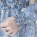 Rochie Silvy albastra cu imprimeu floral si decolteu accesorizat cu nod