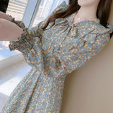 Rochie Silvy verde cu imprimeu floral si decolteu accesorizat cu nod