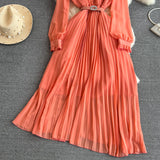 Rochie Hanelore portocalie cu pliuri si curea accesorizata