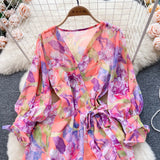 Rochie Gina portocalie cu decolteu in V si imprimeu floral