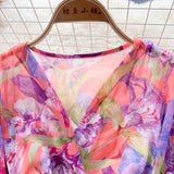 Rochie Gina portocalie cu decolteu in V si imprimeu floral