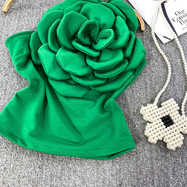 Top Cosima verde cu umar gol si floare tridimensionala