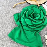 Top Cosima verde cu umar gol si floare tridimensionala
