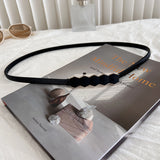 Curea subtire cu elemente decorative in mijloc