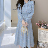 Rochie Silvy albastra cu imprimeu floral si decolteu accesorizat cu nod