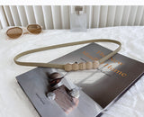 Curea subtire cu elemente decorative in mijloc