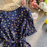 Rochie Arcelia bleumarin cu imprimeu floral si cordon accesorizat