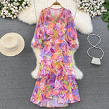 Rochie Gina portocalie cu decolteu in V si imprimeu floral