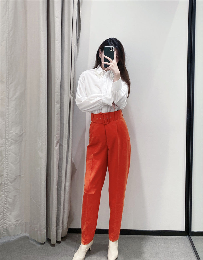 Pantaloni Stezzia portocalii conici accesorizati cu o curea