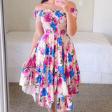 Rochie Marilyn roz cu imprimeu floral si croi asimetric