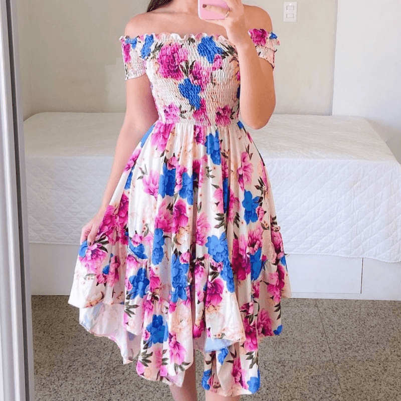 Rochie Marilyn roz cu imprimeu floral si croi asimetric