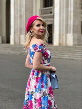 Rochie Marilyn roz cu imprimeu floral si croi asimetric