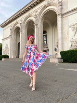 Rochie Marilyn roz cu imprimeu floral si croi asimetric