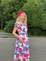 Rochie Marilyn roz cu imprimeu floral si croi asimetric