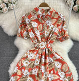 Rochie Gamma portocalie cu imprimeu floral si curea accesorizata