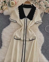 Rochie Eranthe neagra din tricot cu guler lat si nasturi decorativi