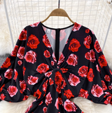 Rochie Abdi neagra cu flori rosii cu decolteu in V si maneci lasate tip clopot