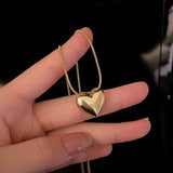 Colier auriu cu pandantiv metalic inima