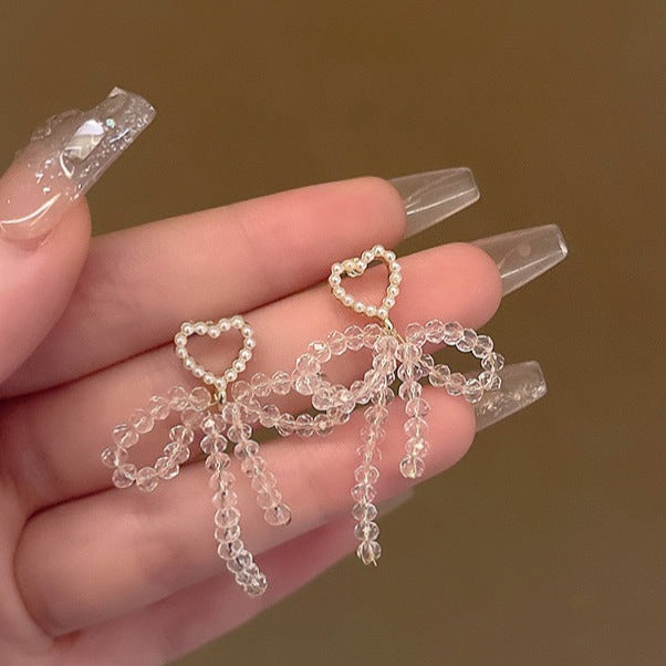 Cercei lungi cu fundita din cristale si inima din perle, ace de argint S925