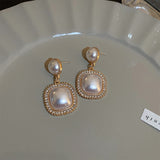 Cercei cu pandantiv tip perla patrata cu margini aurii, ace de argint 925