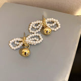 Cercei in forma de fundita cu perle albe si pandantiv auriu, ace de argint S925