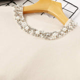 Pulover Rosemary crem din tricot moale cu decolteu si mansete accesorizate cu perle