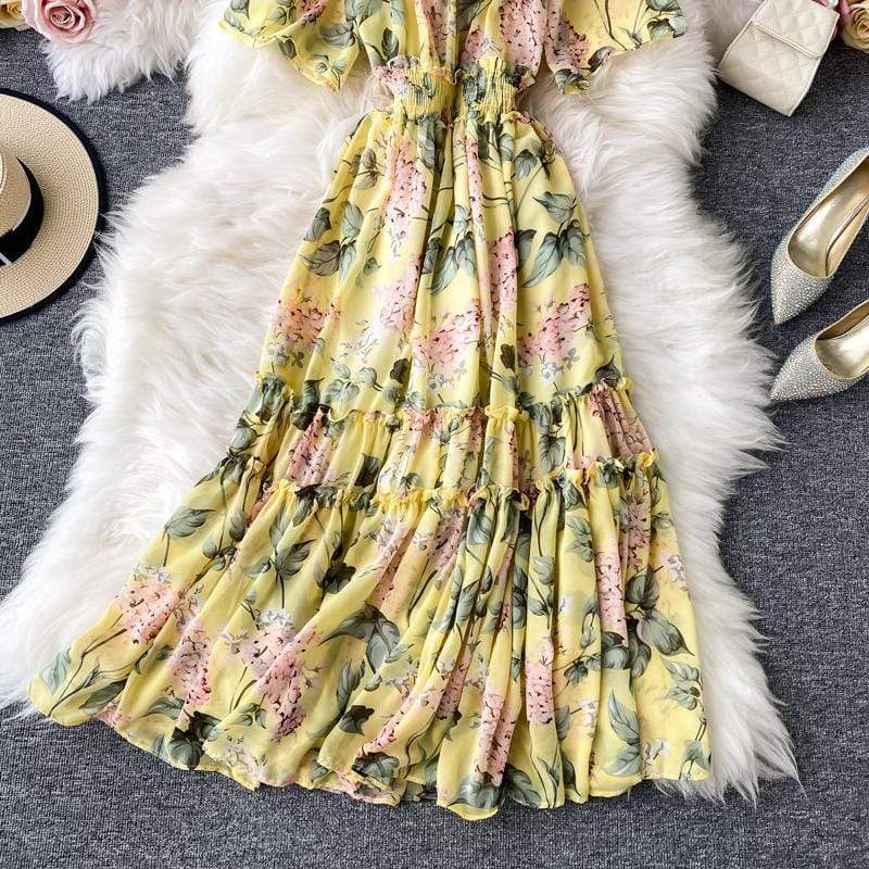Rochie Damiana galbena cu imprimeu floral, decolteu tip barcuta si elastic in talie