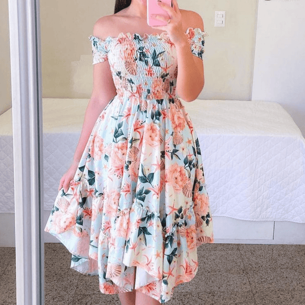 Rochie Marilyn albastru deschis cu imprimeu floral si croi asimetric