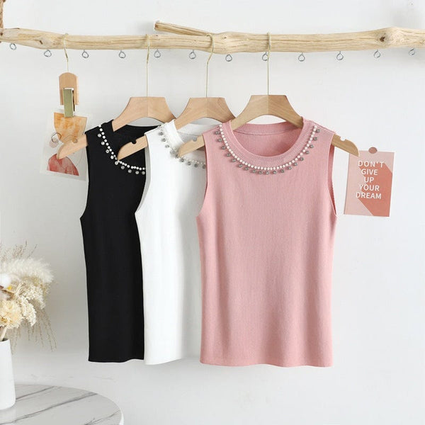 Top Esmera negru accesorizat la baza decolteului